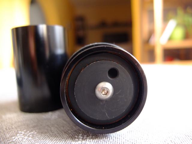 Bottom view of the Aergrind. You can see the black steel burrs